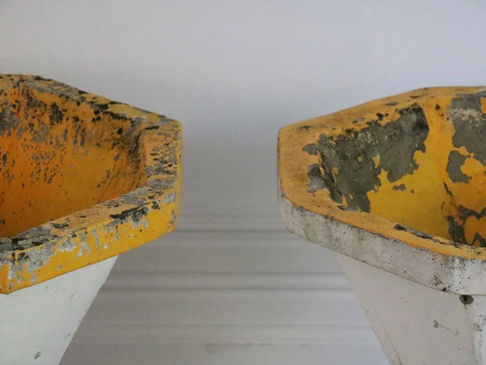 A pair of supercool white and yellow 50's planters