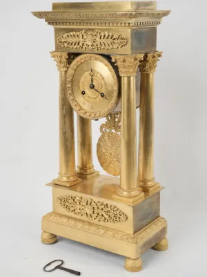 Empire period portico clock - ormolu 17¾"